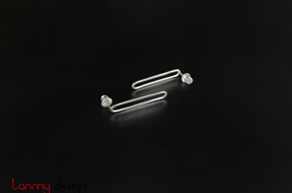 Silver earrings in the shape of paper pins